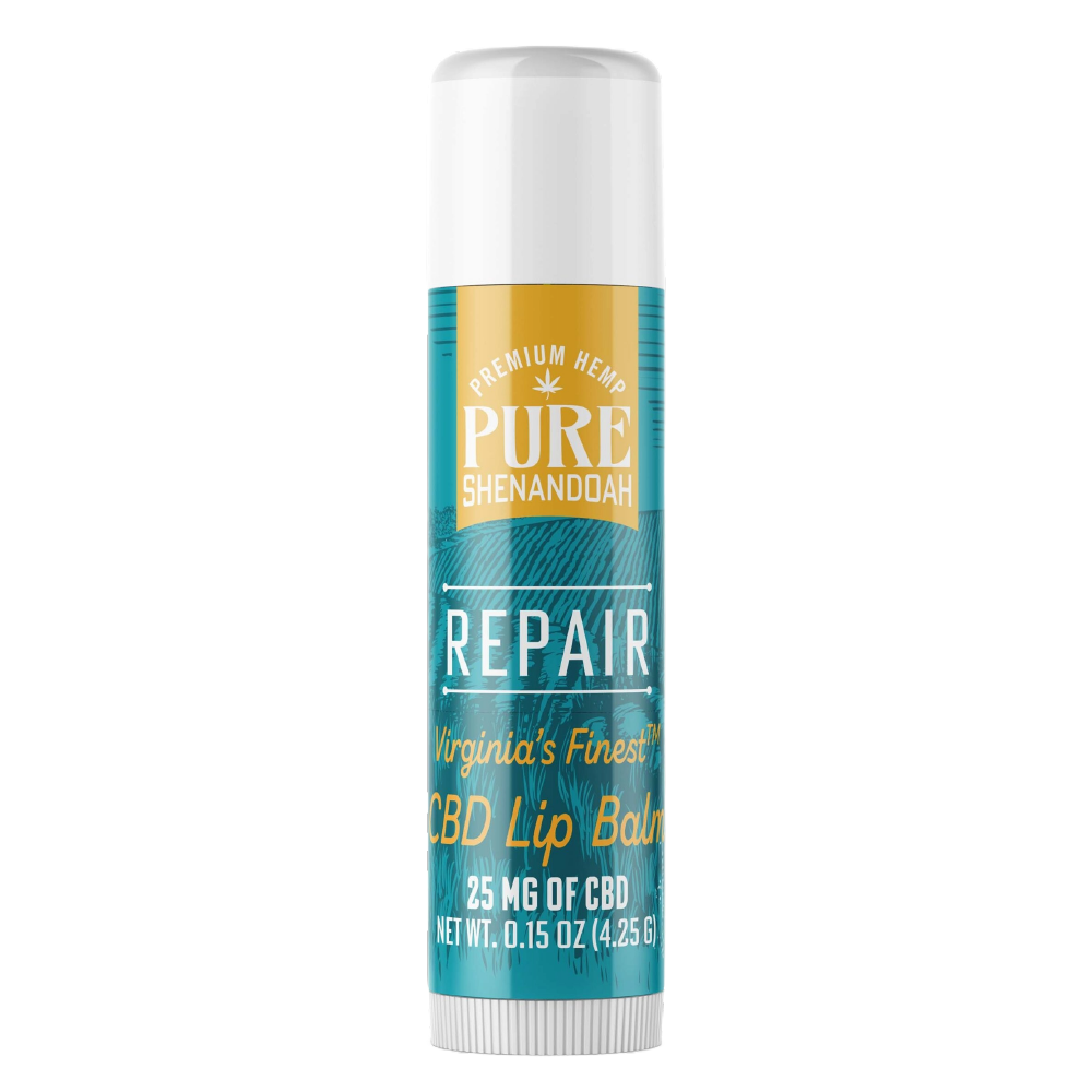 Pure Shenandoah Repair CBD Lip Balm tube, teal and gold label with brand logo, 25 mg CBD, and net weight of 0.15 oz (4.25 g).