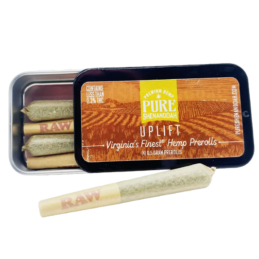 Pure Shenandoah Uplift Pre-Rolls tin, open with visible hemp joints and one pre-roll placed in front, orange and yellow packaging labeled "Virginia’s Finest Hemp Prerolls," four 0.5 g pre-rolls.